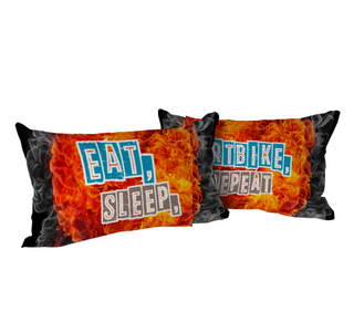 two pillows with the words eat, sleep, and fire on them