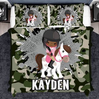 a bed with a girl riding a horse on it