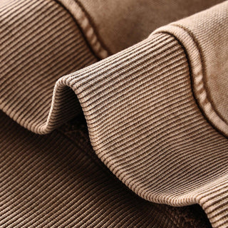 a close up of a brown sweater with ribbings