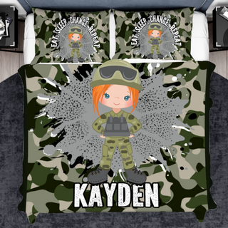 a bed with a camouflage print and a girl in a helmet