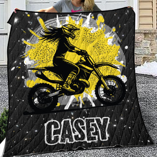 a woman holding a black and yellow motorcycle blanket