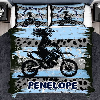 a bed cover with a picture of a person on a motorcycle