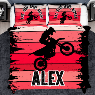 a bed with a picture of a person on a dirt bike