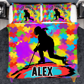 a bed with a colorful cover with a picture of a person skiing