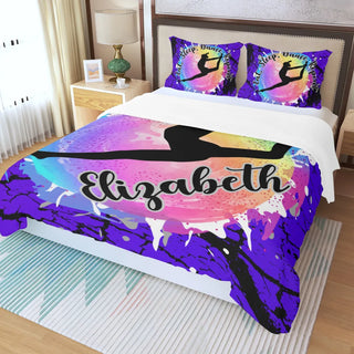 a bed with a colorful comforter and pillows