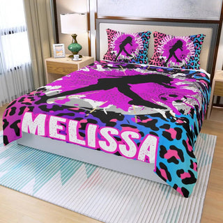 a bed with a pink, blue, and black bed spread