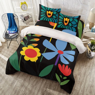 a bed covered in a black and colorful comforter