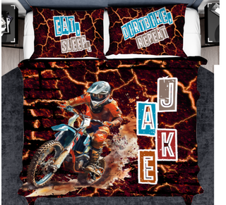 a bed with a picture of a dirt bike rider on it