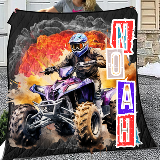 a woman holding up a blanket with a picture of a man on a atv