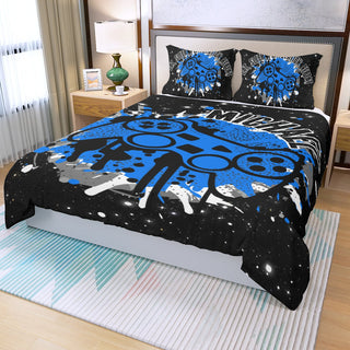 a bed covered in a blue and black comforter