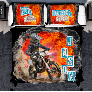 a bed with a picture of a motorcyclist on it