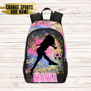 a colorful backpack with a girl kicking a soccer ball