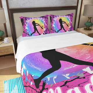 a bed with two pillows and a picture of a woman on it