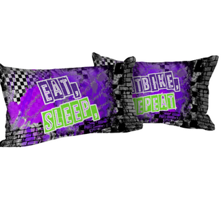 a pair of purple and black pillows with the words eat sleep repeat