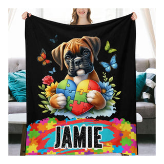 a woman holding a blanket with a dog holding a puzzle