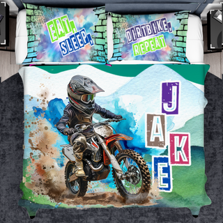 a bed cover with a picture of a dirt bike rider