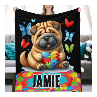 a woman holding a blanket with a dog on it