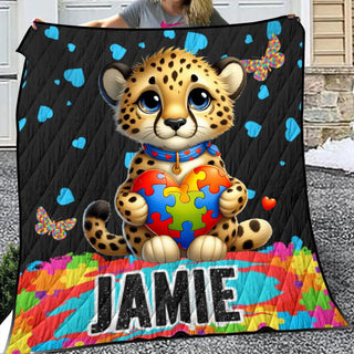 a girl holding a blanket with a picture of a cheetah holding a heart