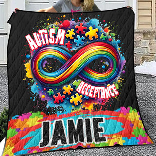 a woman holding up a colorful blanket with an image of an infinite sign