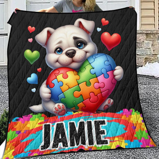 a woman is holding a colorful puzzle blanket