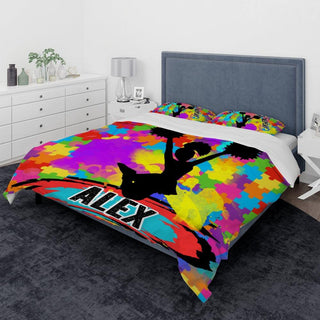 a bed with a colorful comforter and pillows