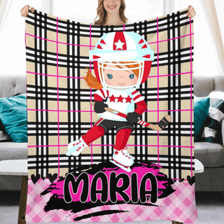 a woman holding a blanket with a picture of a hockey player on it