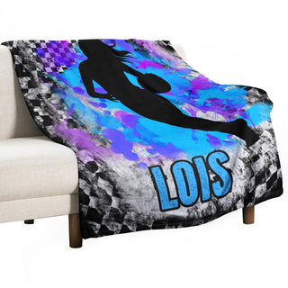 a couch with a mermaid blanket on top of it