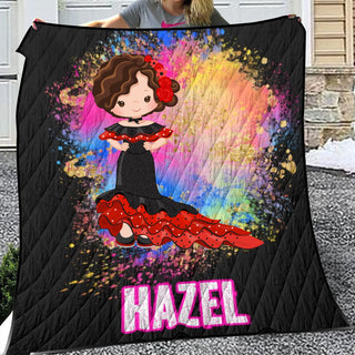 a woman holding a blanket with a picture of a girl on it