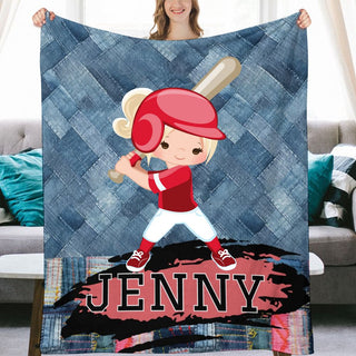 a girl holding a blanket with a picture of a baseball player