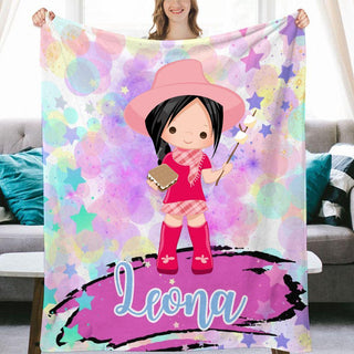 a woman holding a personalized blanket with a picture of a girl in a pink