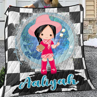 a girl with a pink hat holding a black and white checkered blanket