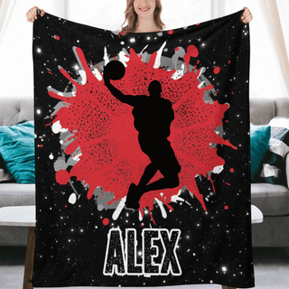 a woman holding a blanket with a basketball player on it