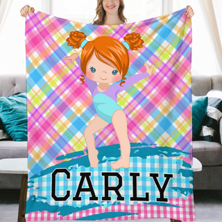 a girl holding up a personalized beach towel