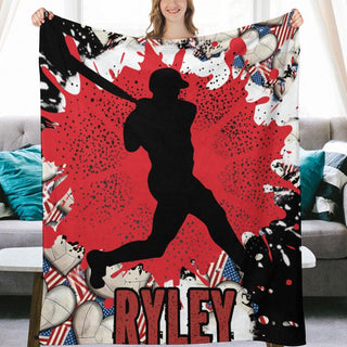 a woman holding up a blanket with a picture of a baseball player