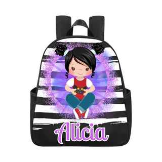 a backpack with a picture of a girl sitting on the ground