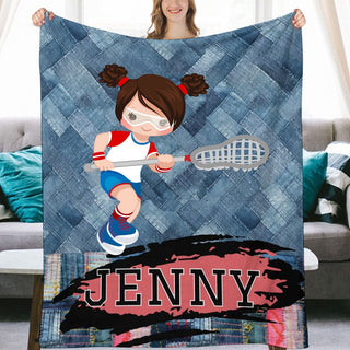 a woman holding a blanket with a picture of a girl on it