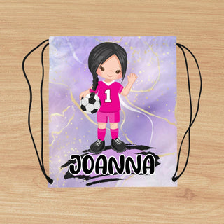 a drawstring bag with a girl holding a soccer ball