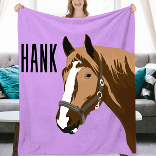 a woman holding a blanket with a horse on it