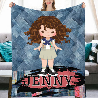 a girl holding up a personalized blanket