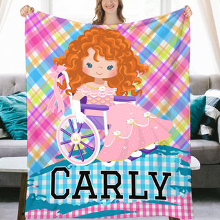 a girl holding up a personalized blanket