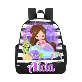 a black and white backpack with a mermaid on it