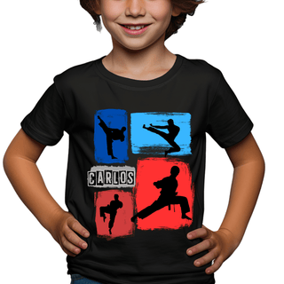 a young boy wearing a black t - shirt with a picture of a boy doing