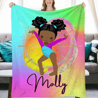 a girl holding up a personalized blanket