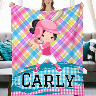 a girl holding up a personalized blanket