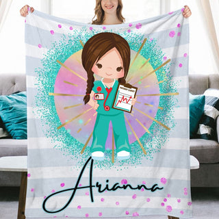 a woman holding up a personalized blanket