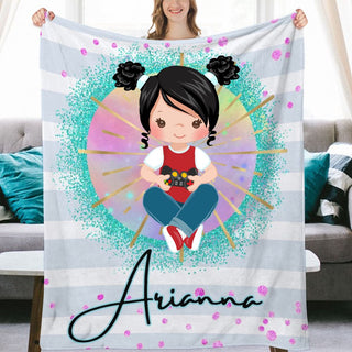 a woman holding up a personalized blanket