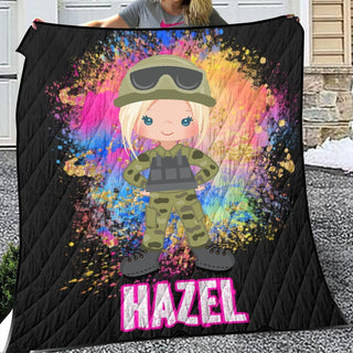 a woman holding up a blanket with a picture of a girl in a military uniform