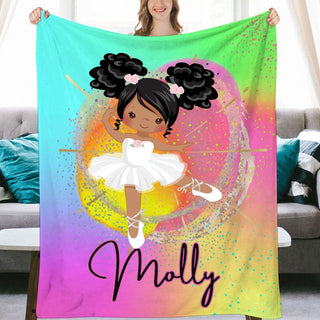 a girl holding up a personalized blanket