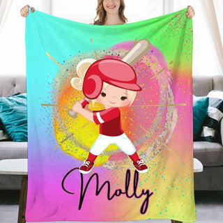 a girl holding up a personalized blanket with a baseball player on it