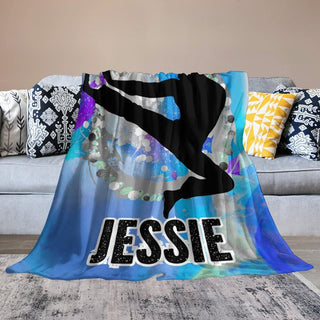 a couch with a blanket that has a picture of a person on it